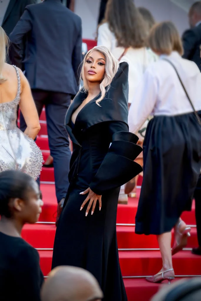 A sculptural black outfit and sleek blonde hair on the red carpet
